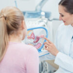 Childless woman in fertility clinic talking to doctor